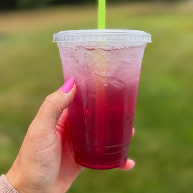 Blue Lotus drink with green straw